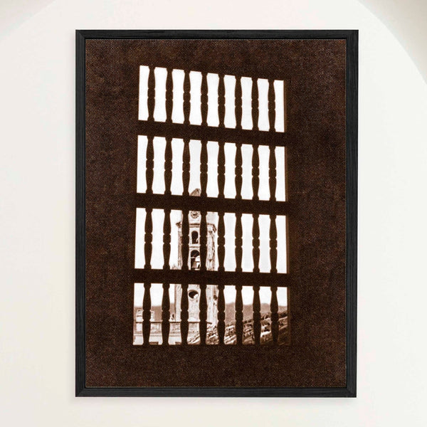 Sepia photograph of Trinidad's bell tower seen through a shuttered window in 1948, framed in oak. Close view.