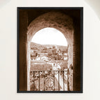 Framed vintage sepia 1948 photograph of Trinidad Cuba vista through the bell tower arch of San Francisco monastery. Close view.