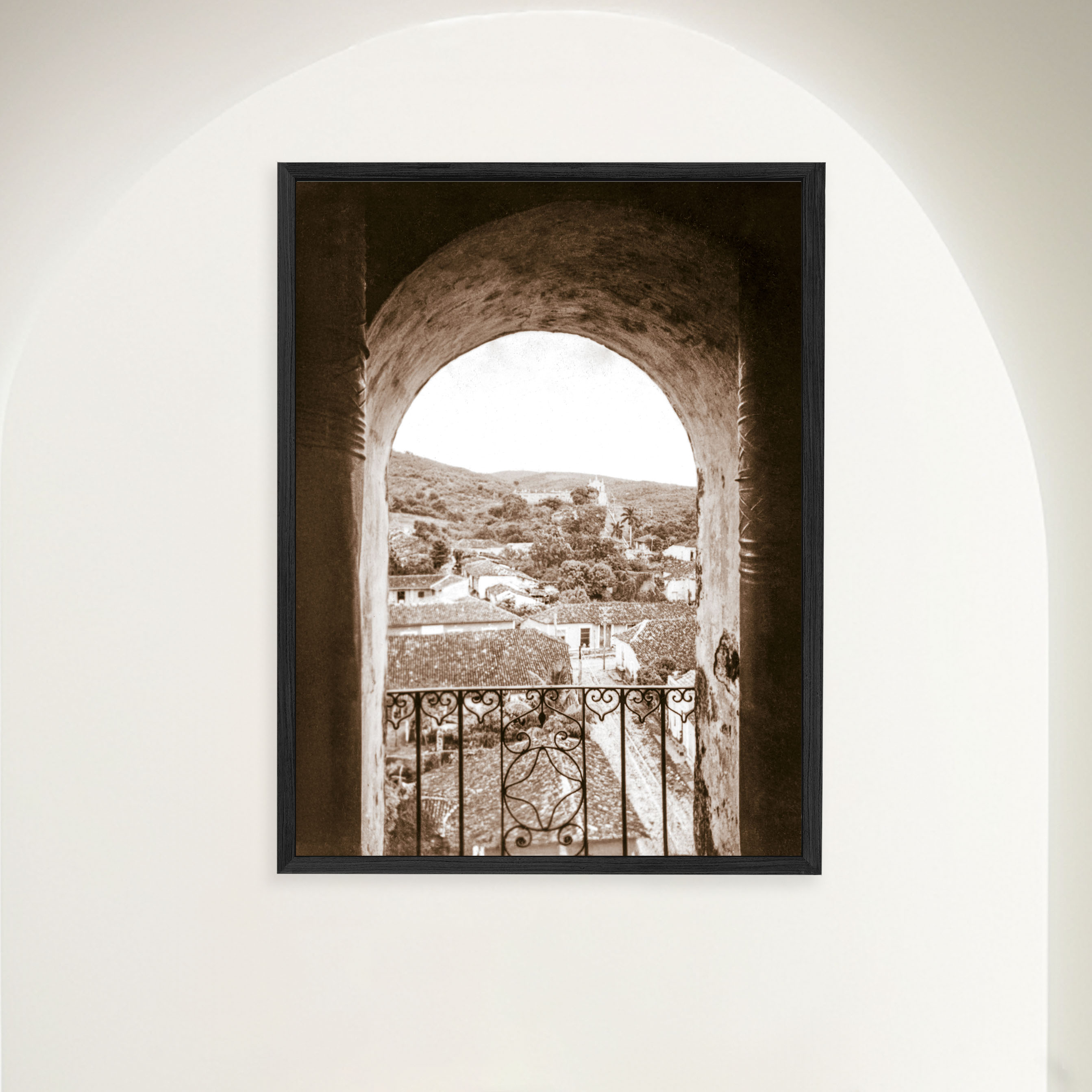 Framed vintage sepia 1948 photograph of Trinidad Cuba vista through the bell tower arch of San Francisco monastery.