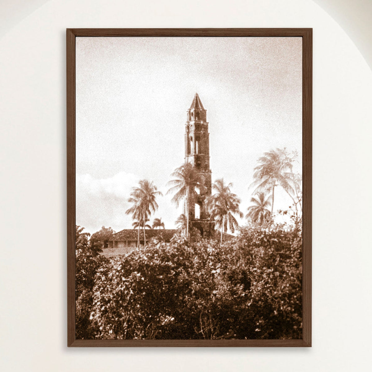 Sepia photograph of the Torre Manaca-Iznaga rising above palms in 1940s Cuba, framed in oak. Close view.