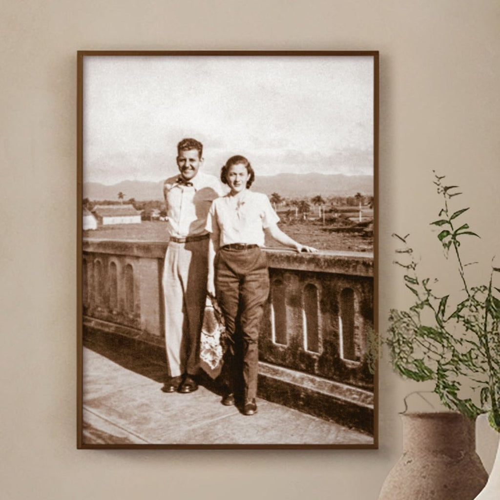 Sepia photograph of a 1948 roadside stop on Cuba's Carretera Central, framed in oak, shown on a wall. Close view.