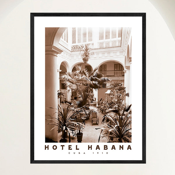 Vintage travel poster of a Spanish Colonial hotel courtyard garden in early 1900s Havana, framed in oak. Close view.