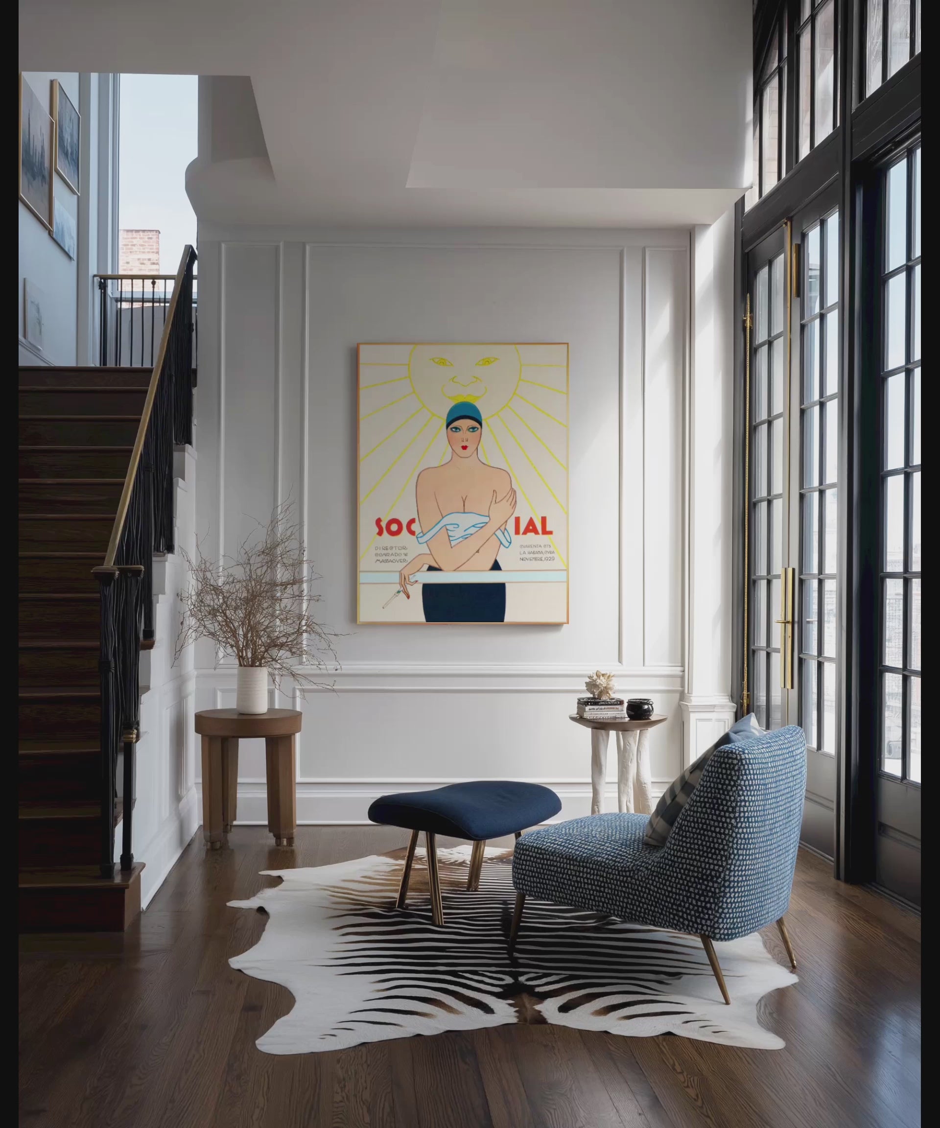 video zoom of Art Deco framed vintage art of woman in bathing suit on cruise ship. Art on wall of elegant hall with French doors and wooden staircase.